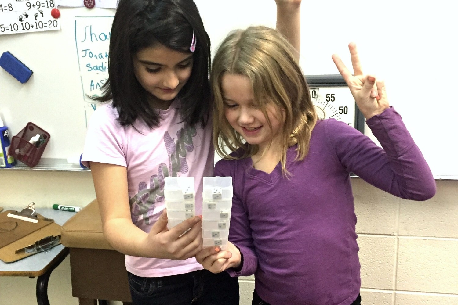students using math shakers in classroom activities